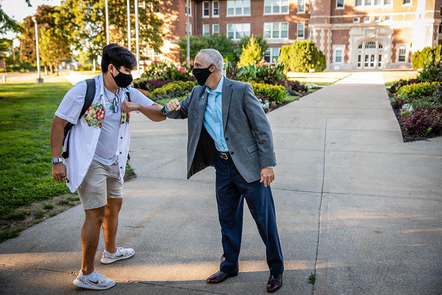 Northwest President Dr. John Jasinski greeted students by bumping their elbows as they walked to classes during the first day of the fall 2020 semester. The University's fall enrollment was the highest in its 115-year history. (Northwest Missouri State University photo)